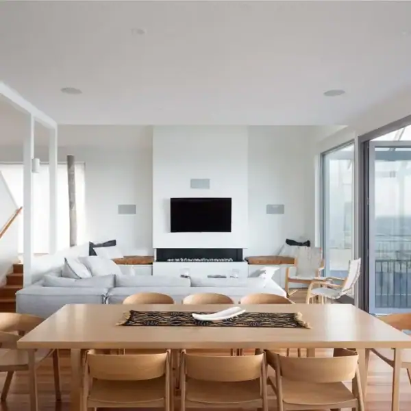 Modern architectural dining room and living space with ocean views in an Austinmer coastal home by Simpson and Co Projects.