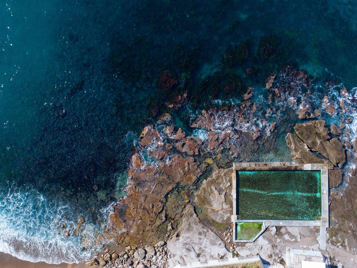 Aerial coastal rock pool along the Illawarra coastline reflecting architectural context and place