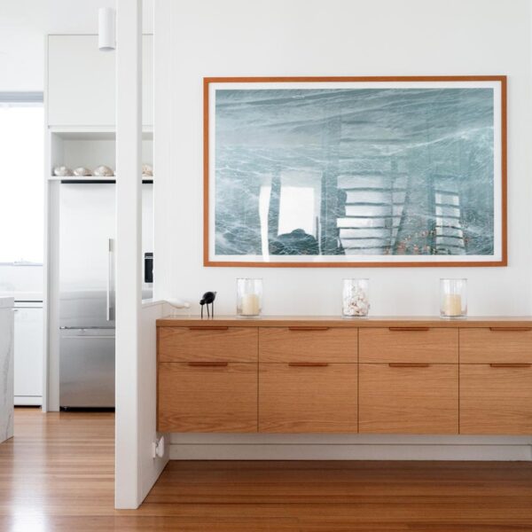 Custom timber sideboard and architectural joinery in the living area of an Austinmer home by Simpson and Co Projects.