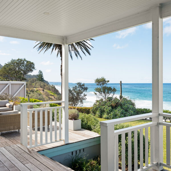 Coastal verandah of the Wombarra No. 3 home by Simpson & Co Projects, showing balustrade, posts and an ocean view beyond.
