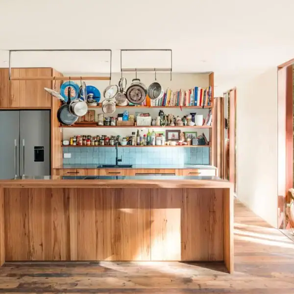 bespoke timber kitchen cabinetry with hanging pot rack and integrated appliances Austinmer