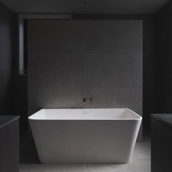 Freestanding bathtub in minimalist bathroom of Stanwell Park coastal custom home.
