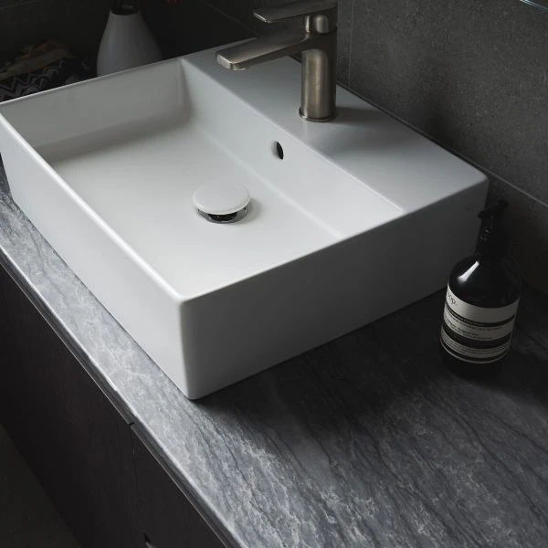 Stone vanity benchtop detail in Stanwell Park custom home bathroom with refined coastal architectural finish